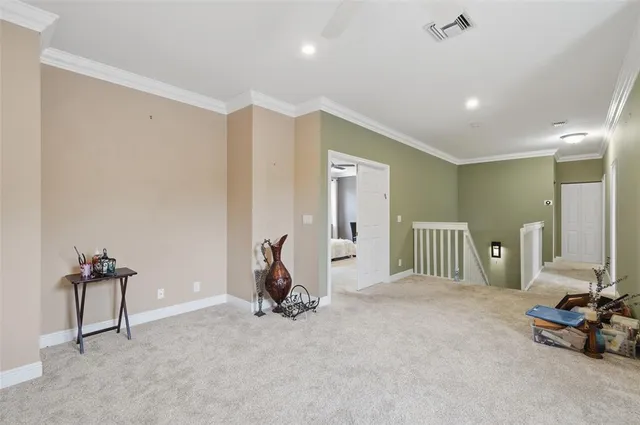a bedroom with a bed dresser and a window