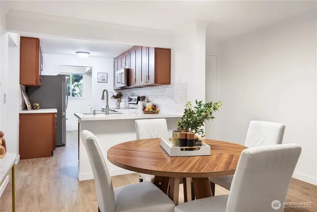 a dining room with furniture and window