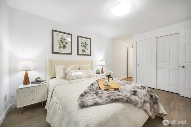 a bedroom with a bed and a night lamp