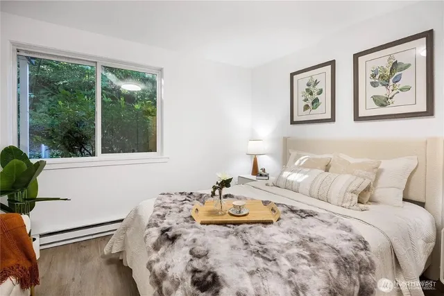 a bedroom with bed and window