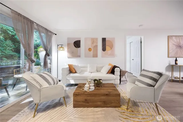 a living room with furniture and large windows