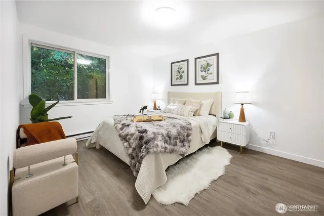 a bedroom with a bed and glass window