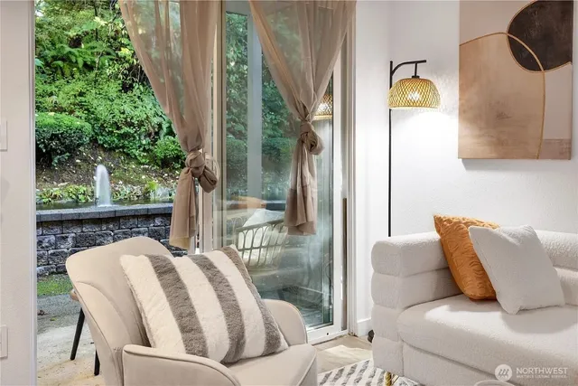 a balcony view with a couch and potted plants