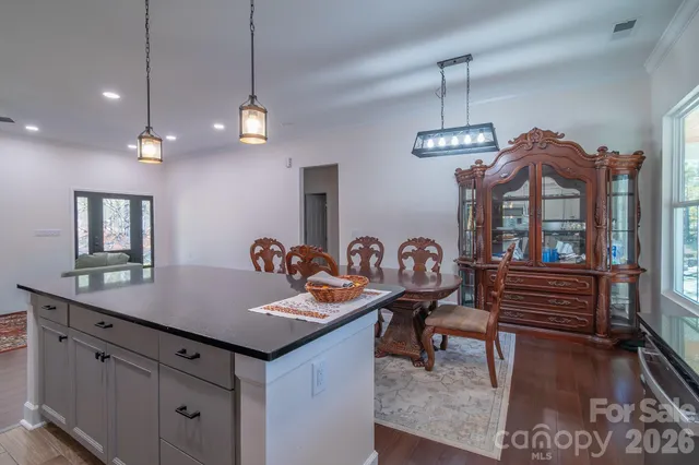 a kitchen with a table and chairs