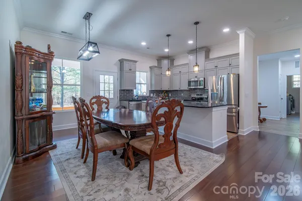 a view of a dining room with furniture