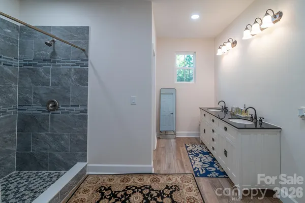 a bathroom with a bathtub and shower