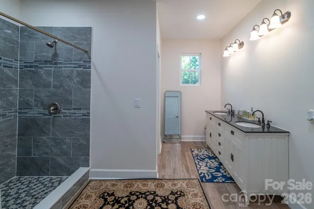 a bathroom with a bathtub and shower