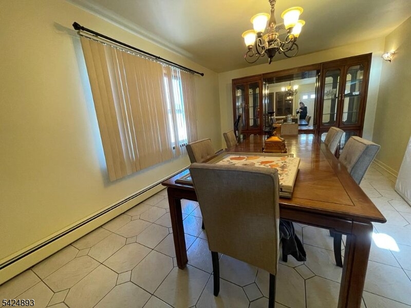 405 Redcliffe Street Elizabeth Port, NJ 07206 - Photo 4 of 10 a view of a dining room with furniture and window