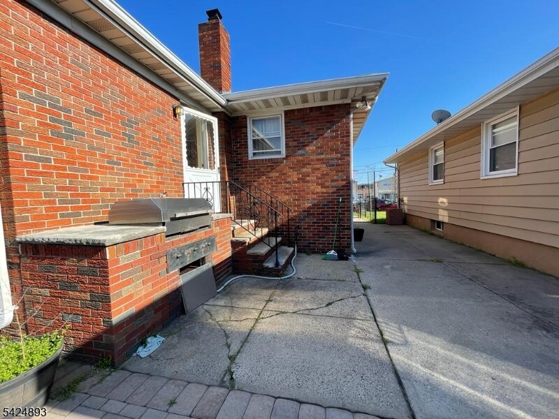 405 Redcliffe Street Elizabeth Port, NJ 07206 - Photo 9 of 10 a view of a house with a yard