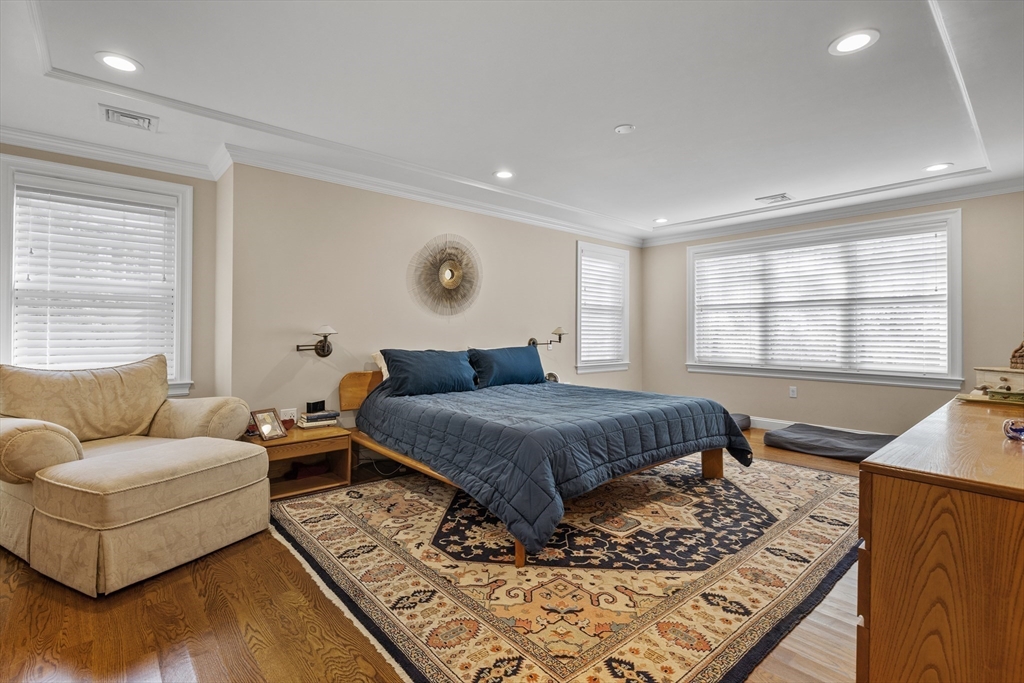 217 Hillcrest Road Needham, MA 02492 - Photo 11 of 17 a bedroom with a bed and wooden floor