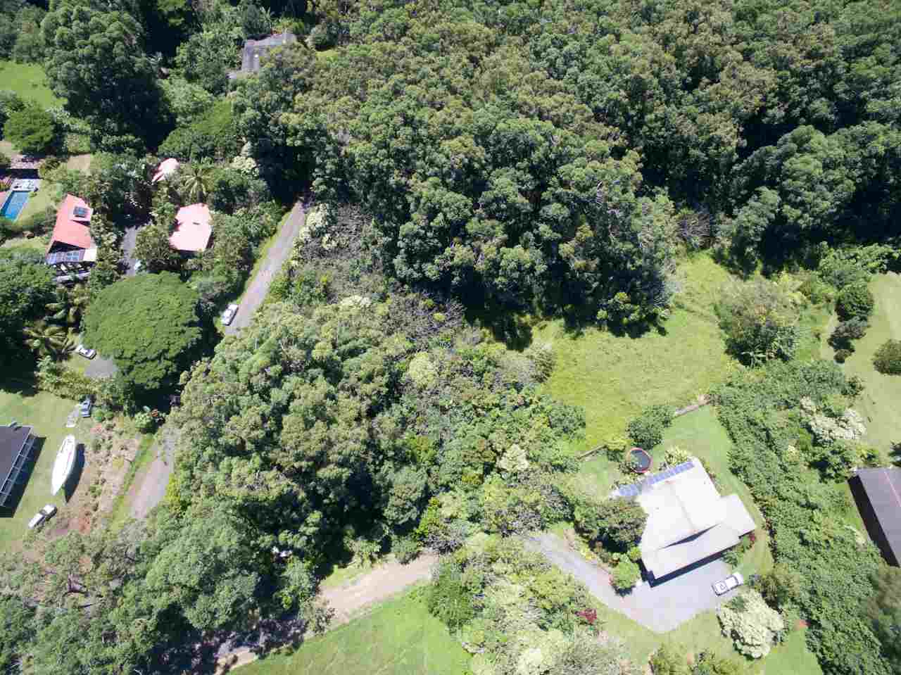 150 Kapuai Road Haiku, HI 96708 - Photo 11 of 25 an aerial view of a house with a yard and large trees