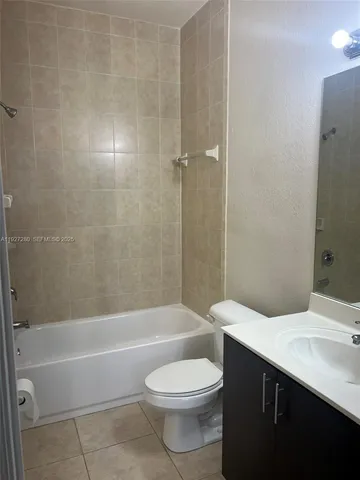 a bathroom with a toilet a sink and bathtub