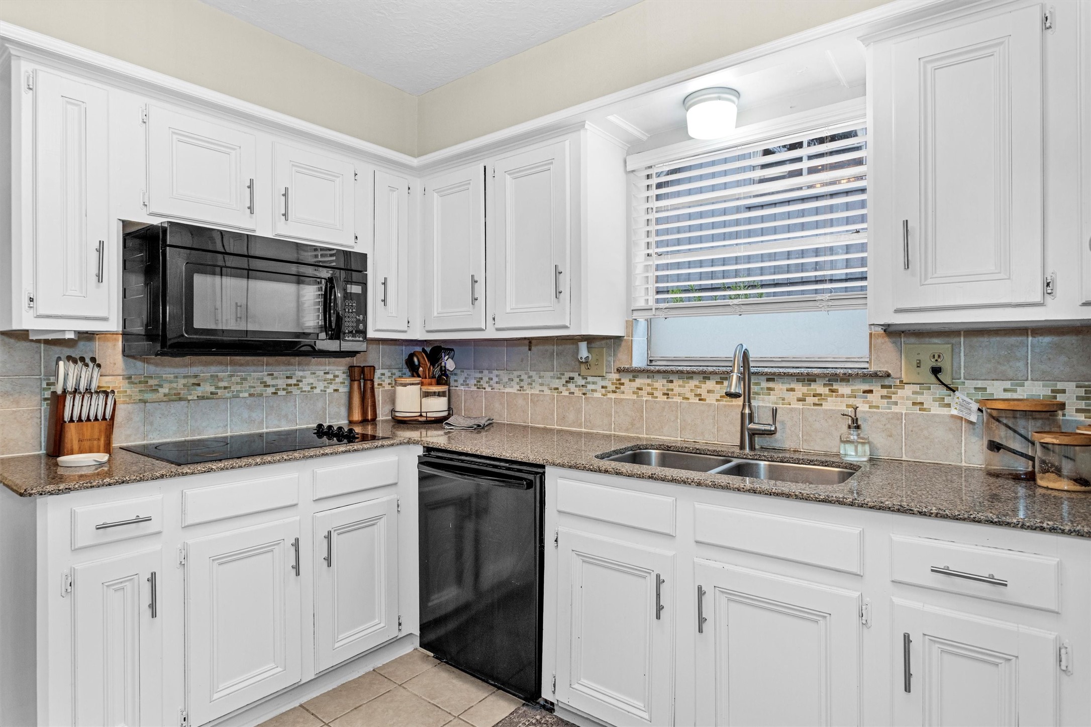 2005 Tickner Street Conroe, TX 77301 - Photo 18 of 50 Gas connections below if you ever want to convert from electric cooktop to a gas cooktop.