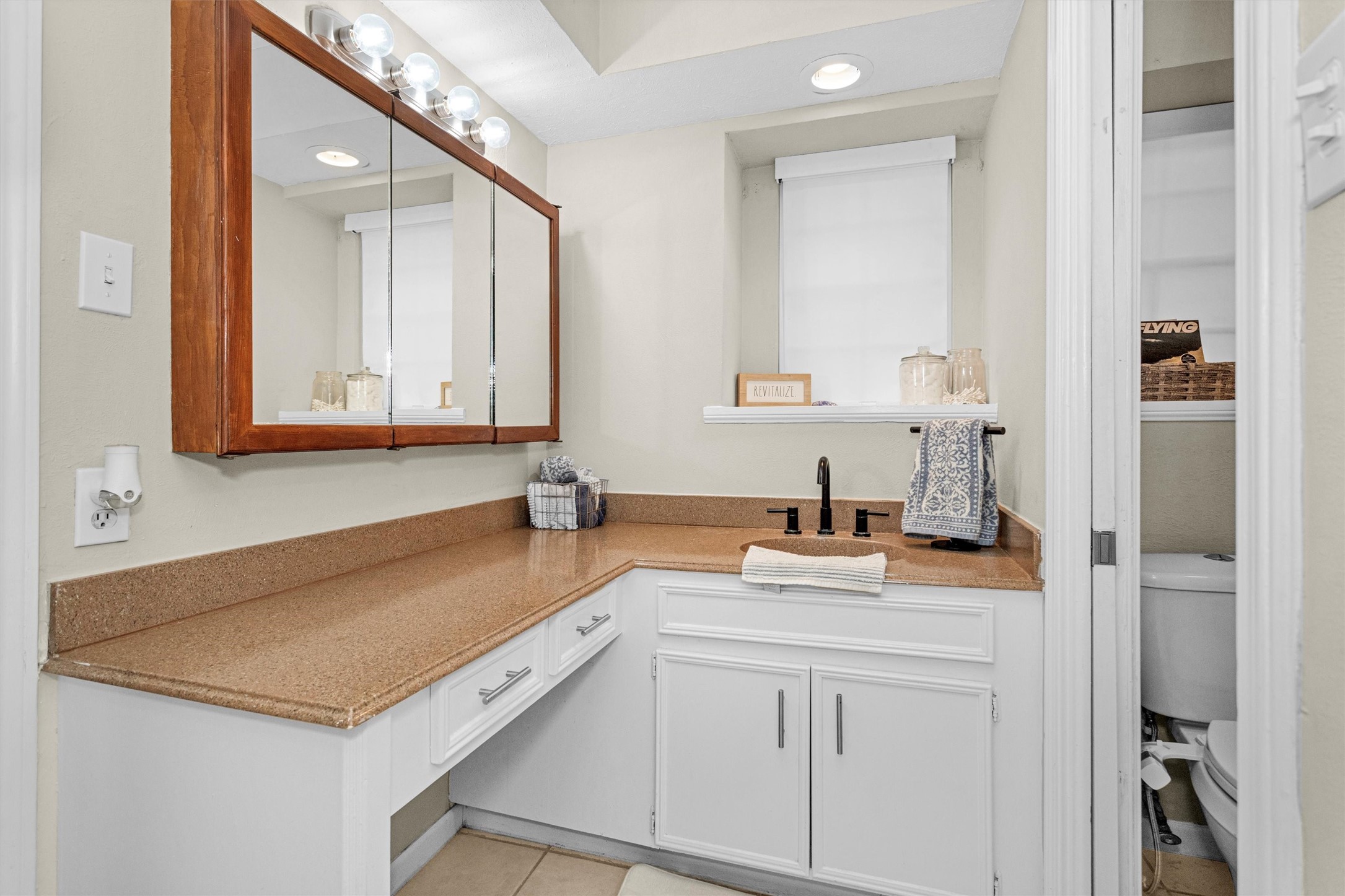 2005 Tickner Street Conroe, TX 77301 - Photo 28 of 50 Ensuite bath to primary bathroom with vanity.