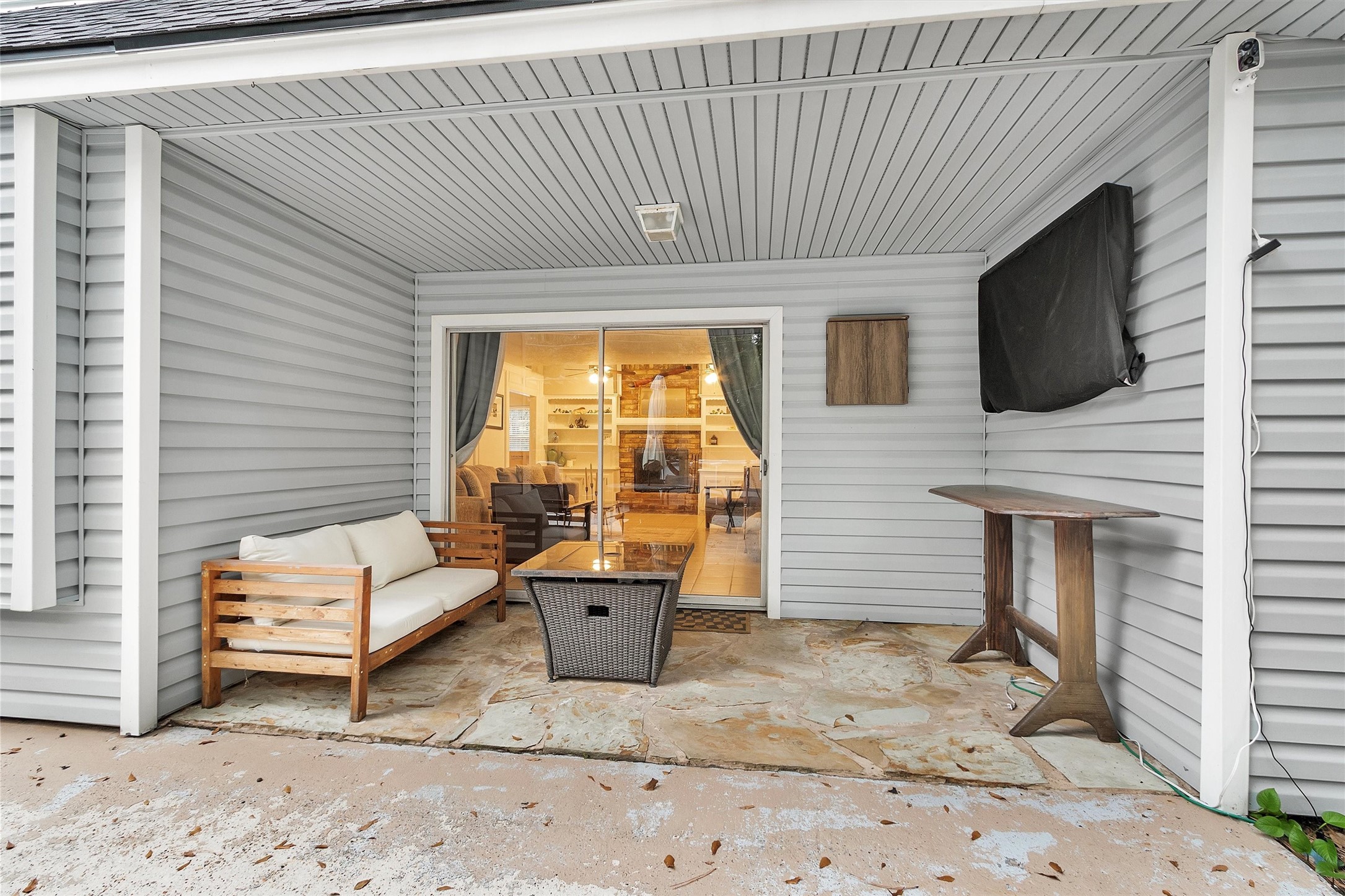 2005 Tickner Street Conroe, TX 77301 - Photo 41 of 50 Cozy covered back patio—perfect spot to relax, unwind, and enjoy the peaceful outdoor setting.