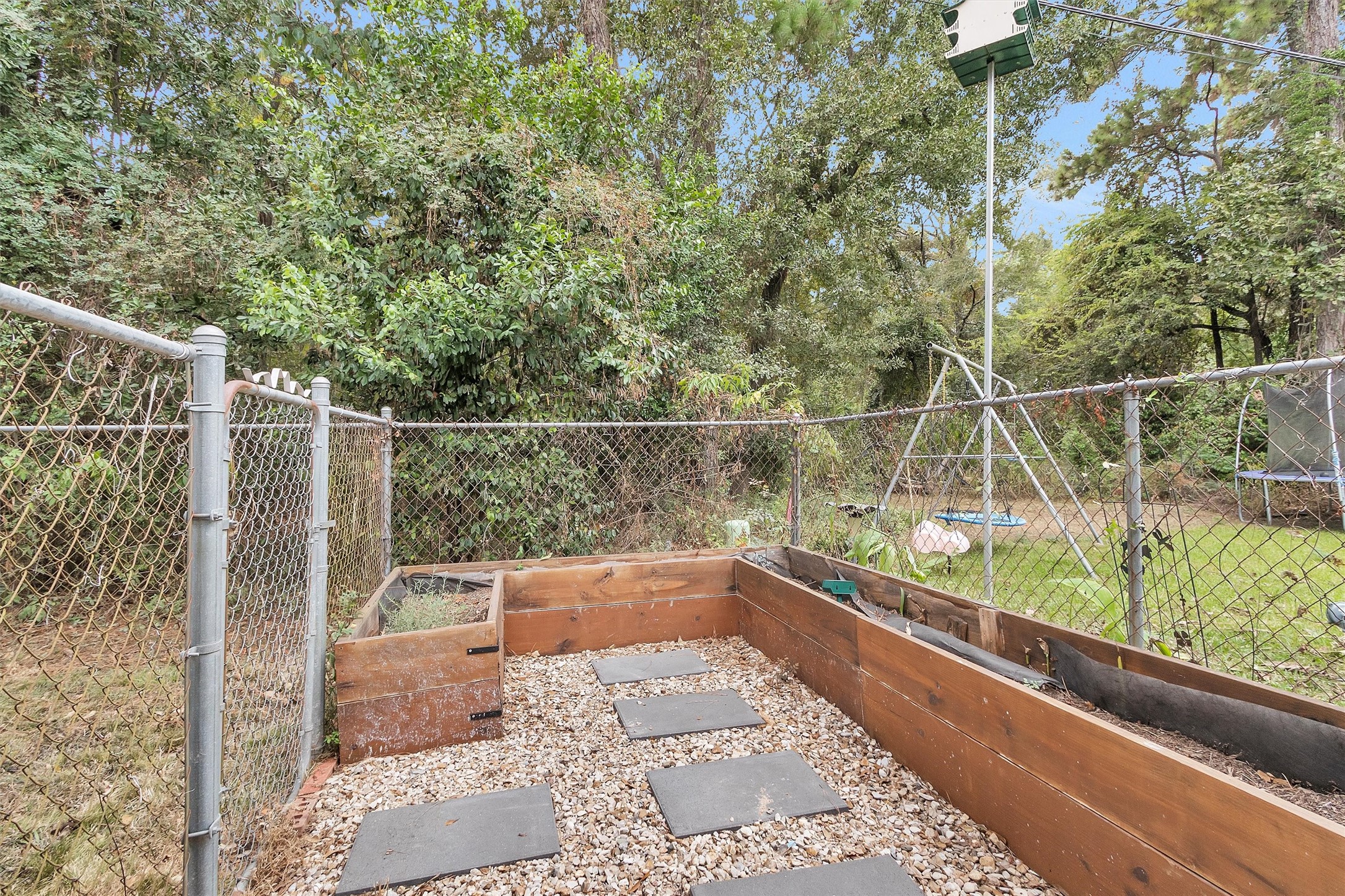 2005 Tickner Street Conroe, TX 77301 - Photo 48 of 50 Fenced garden area—perfect for growing plants or vegetables while keeping pets and wildlife out.
