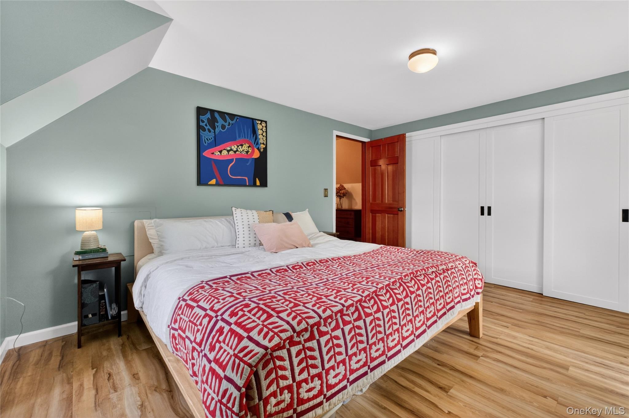 127 Belvedere Road Beacon, NY 12508 - Photo 20 of 37 a bedroom with a bed and a wooden floor