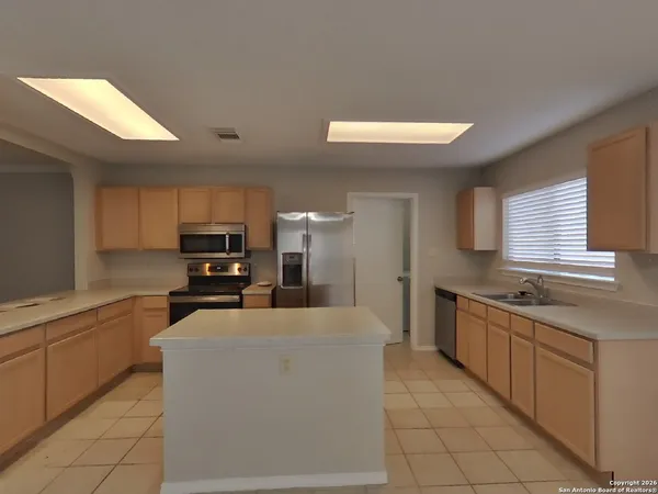 a large kitchen with cabinets