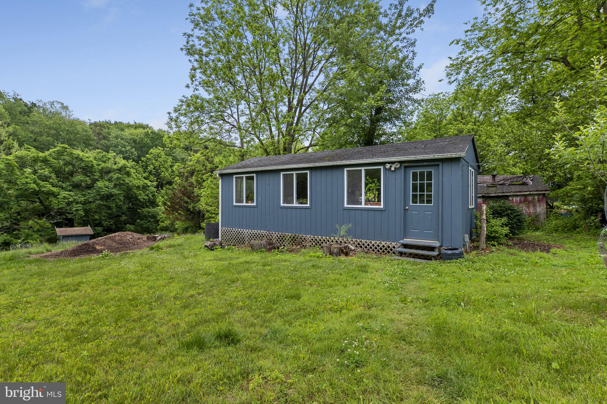 26001 Frederick Road Clarksburg, MD 20871 - Photo 33 of 46 a backyard of a house with lots of green space