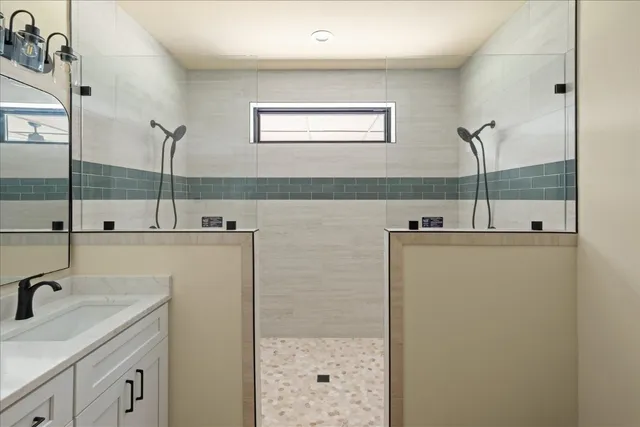 a bathroom with a sink and mirror