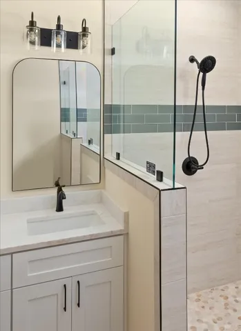a bathroom with a sink and a shower