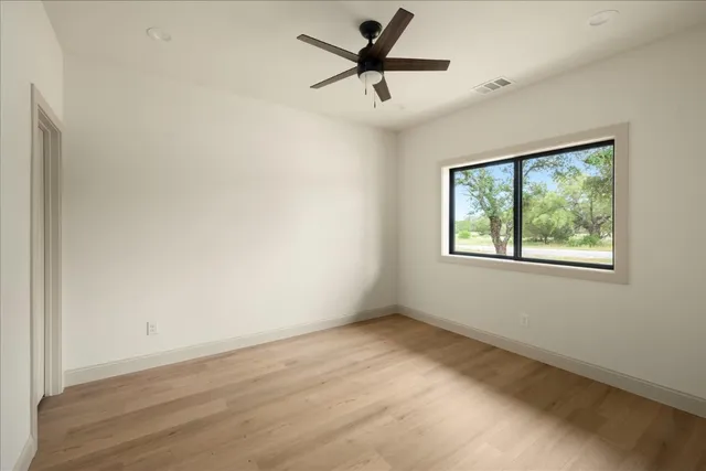 a view of room window and wooden floor