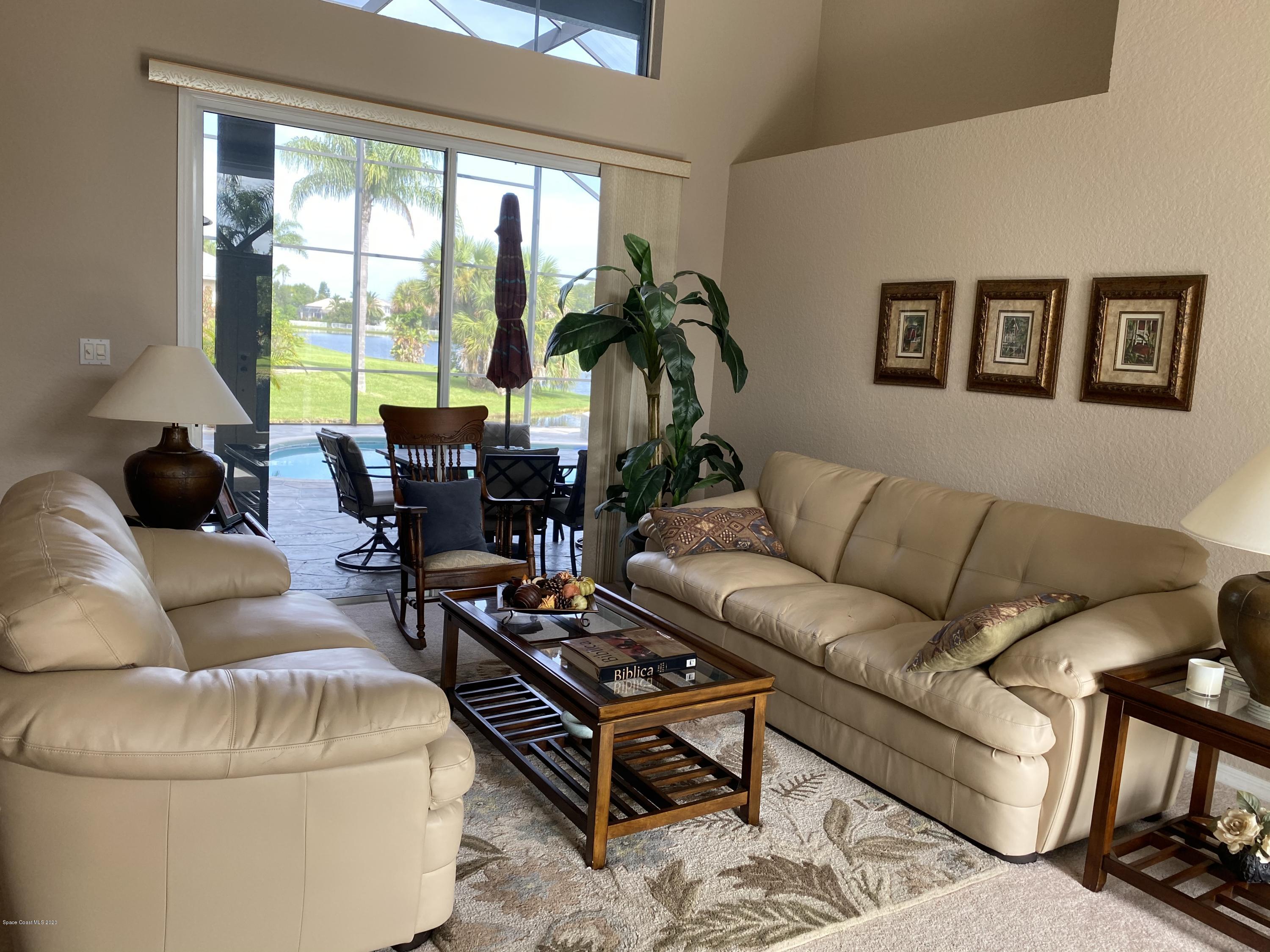 4635 Seminole Trail Merritt Island, FL 32953 - Photo 3 of 31 a living room with furniture and a large window