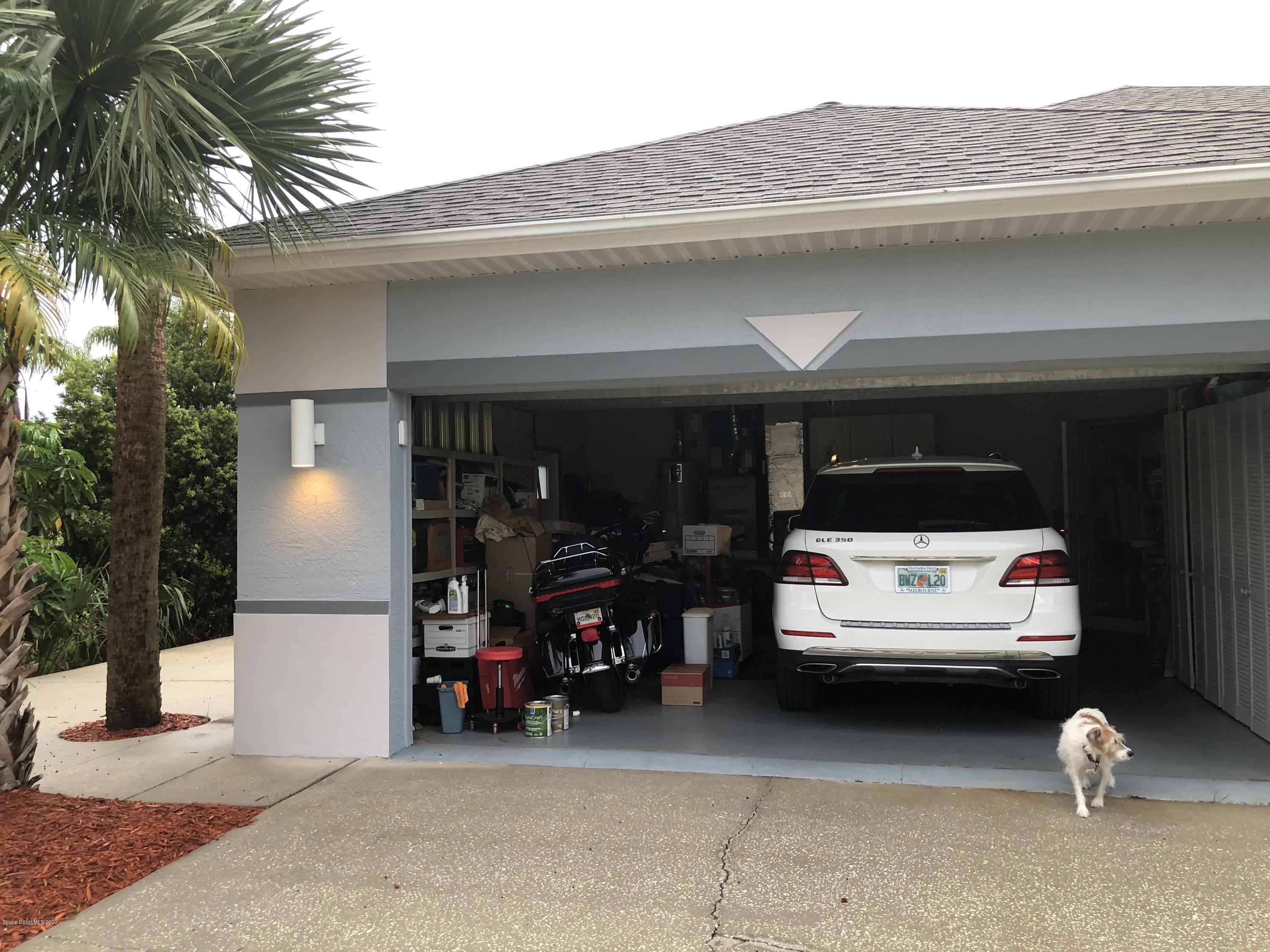 4635 Seminole Trail Merritt Island, FL 32953 - Photo 23 of 31 a car parked in front of a building
