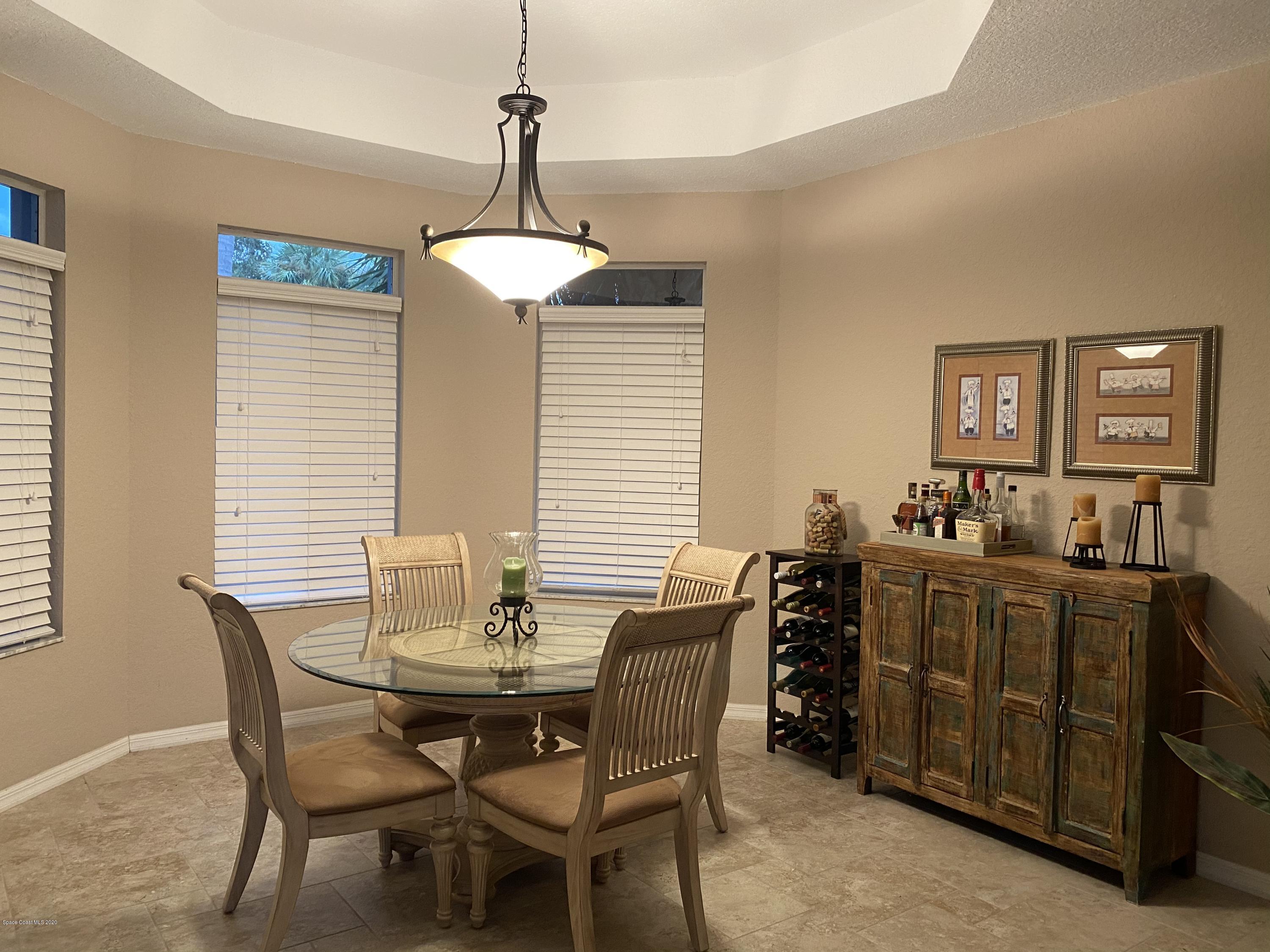 4635 Seminole Trail Merritt Island, FL 32953 - Photo 9 of 31 a view of a dining room with furniture
