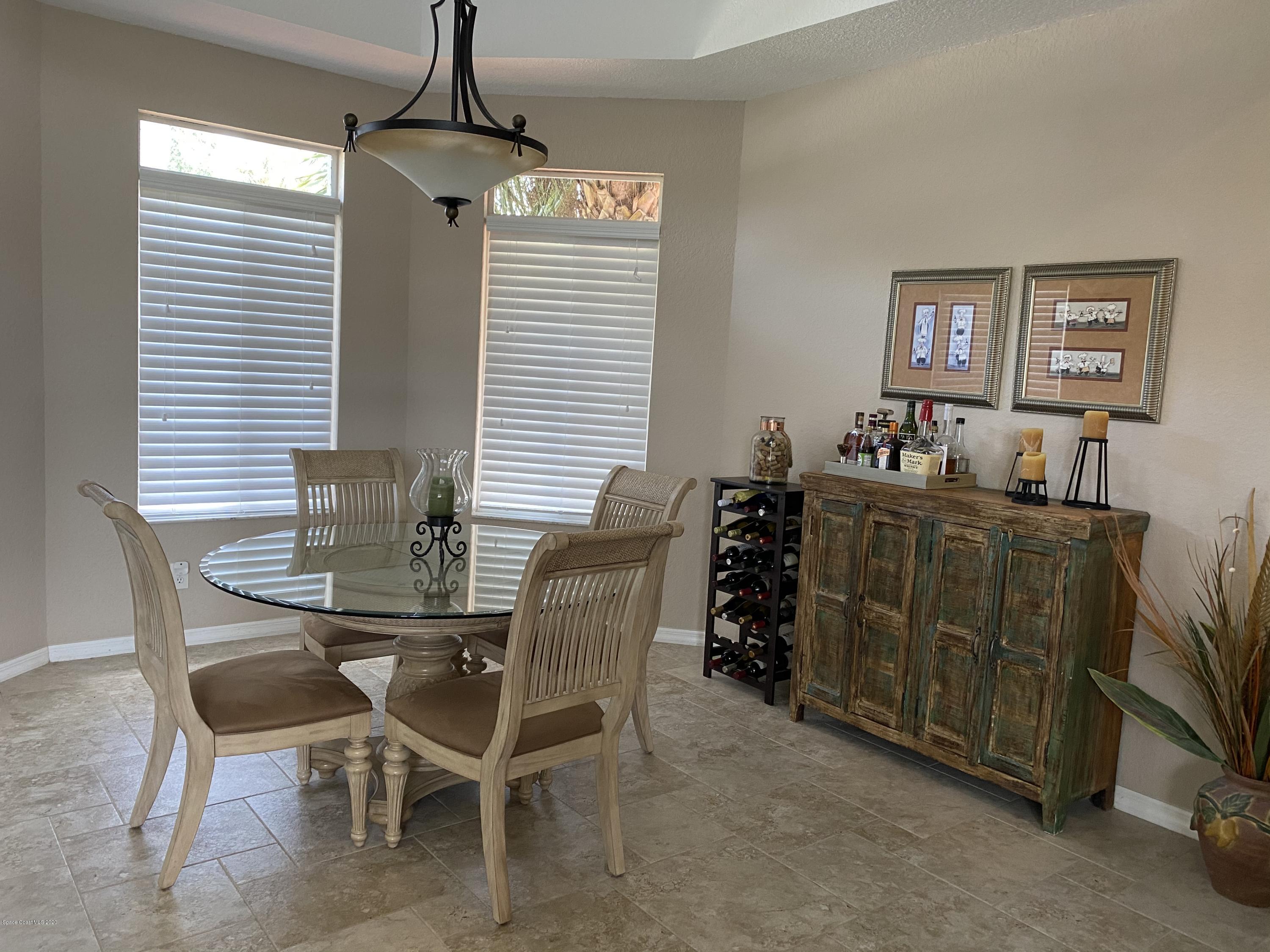 4635 Seminole Trail Merritt Island, FL 32953 - Photo 10 of 31 a dining room with furniture and window
