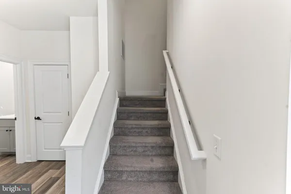 a view of staircase with white walls and white walls