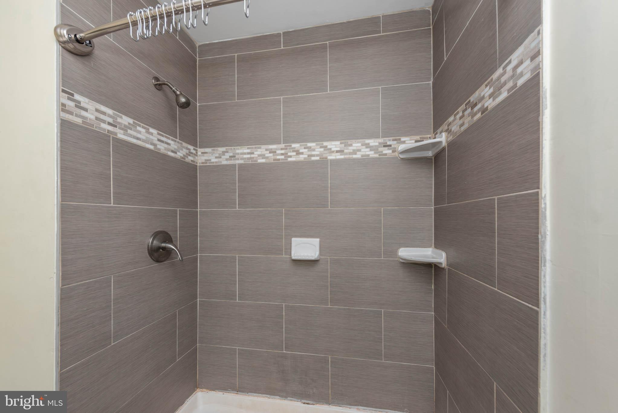 6702 Queens Ferry Road Baltimore, MD 21239 - Photo 14 of 40 a bathroom with a shower