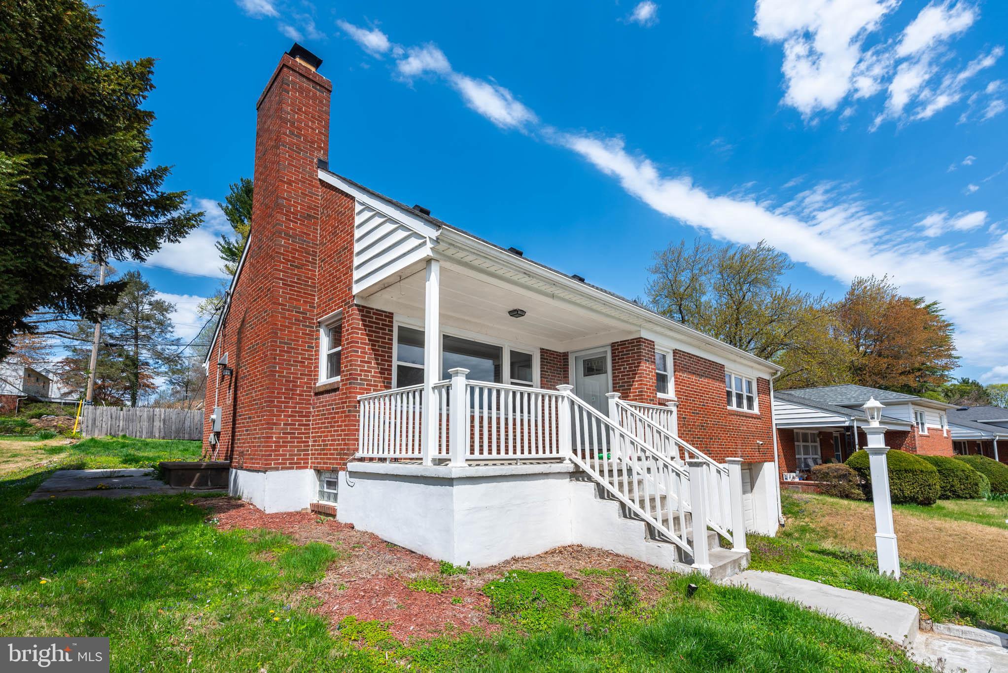 6702 Queens Ferry Road Baltimore, MD 21239 - Photo 38 of 40 front view of house with a yard