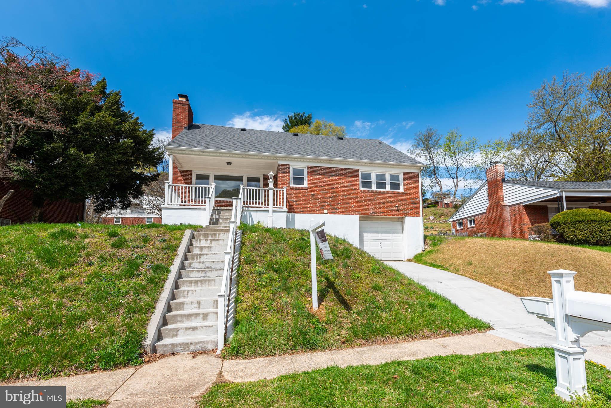 6702 Queens Ferry Road Baltimore, MD 21239 - Photo 40 of 40 a front view of a house with a yard