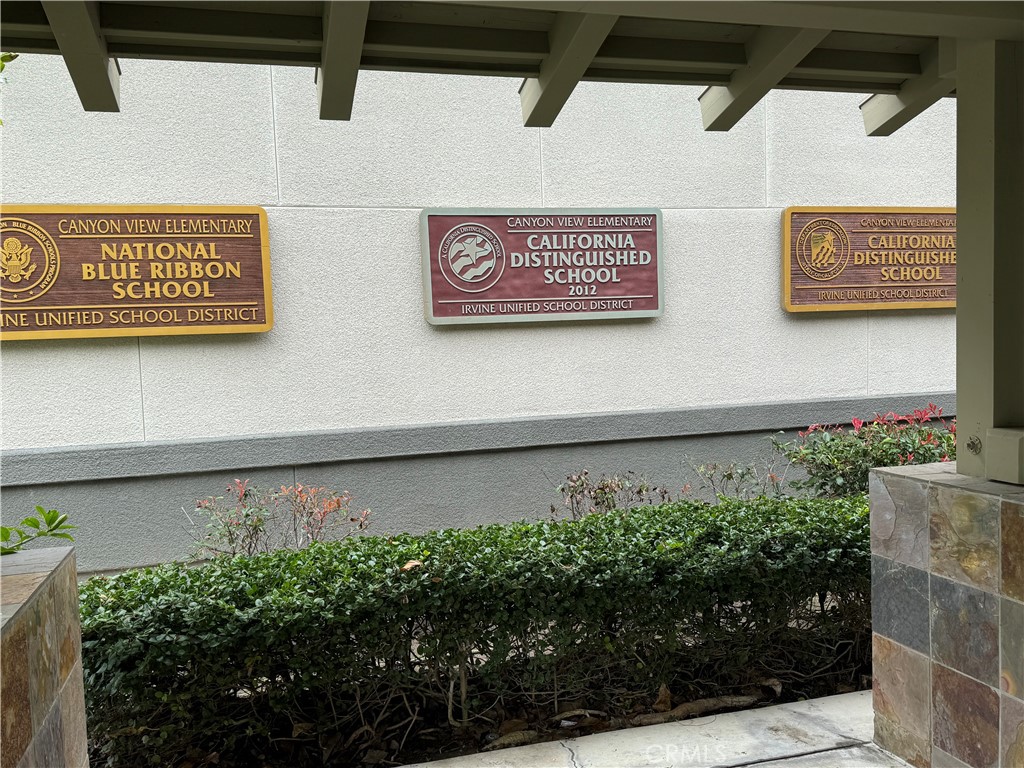 4 Whispering Pine Irvine, CA 92620 - Photo 11 of 12 a view of a sign board with wooden fence