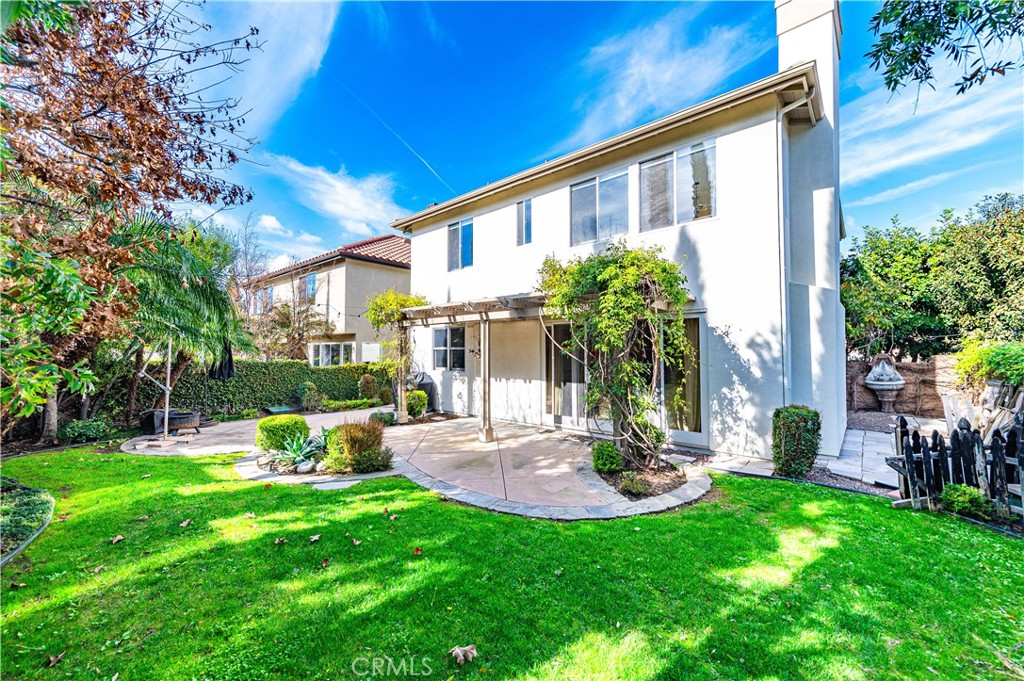 4 Whispering Pine Irvine, CA 92620 - Photo 6 of 12 a view of a chair and table in backyard of the house