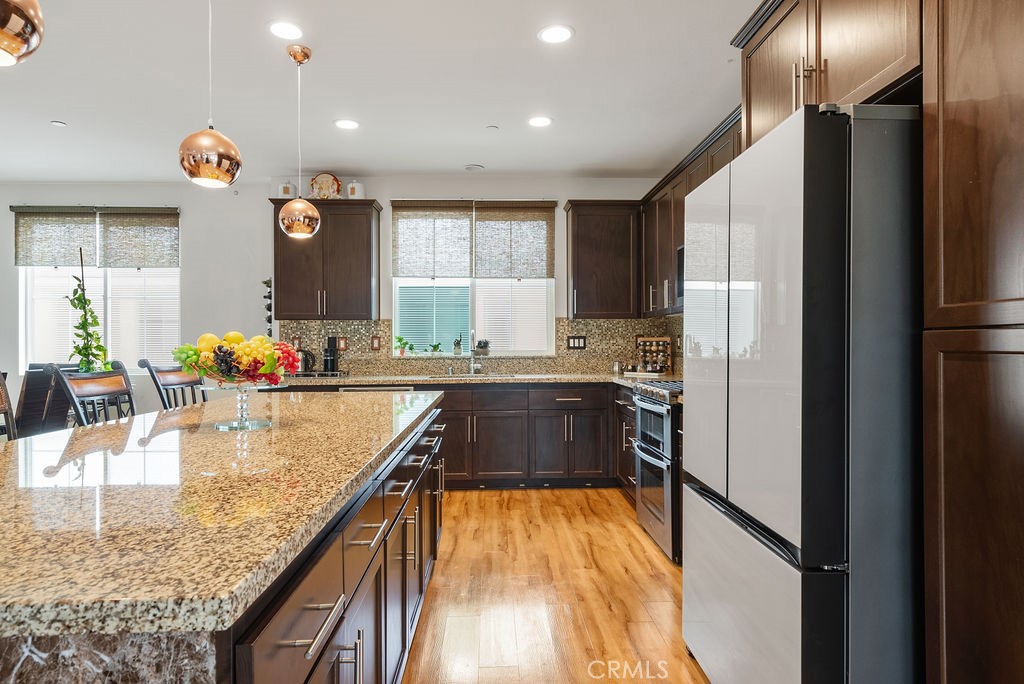 2705 Meyer Lane Pomona, CA 91767 - Photo 27 of 63 a kitchen with counter top space a sink and appliances