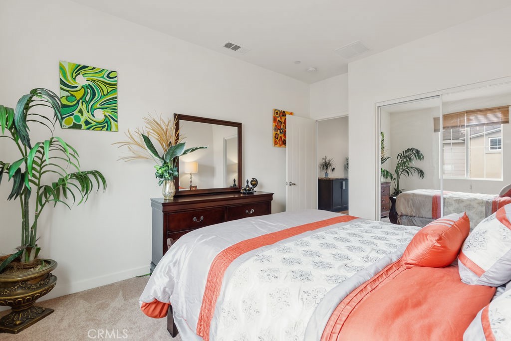 2705 Meyer Lane Pomona, CA 91767 - Photo 44 of 63 a bedroom with a bed and a potted plant