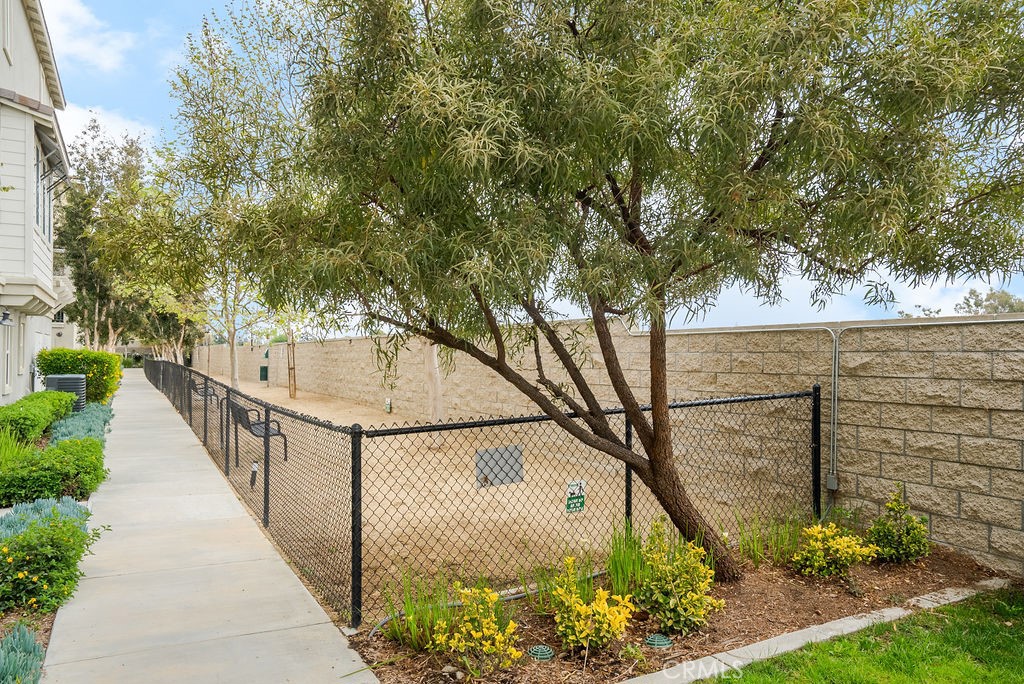 2705 Meyer Lane Pomona, CA 91767 - Photo 6 of 63 a view of a pathway with a wrought fence