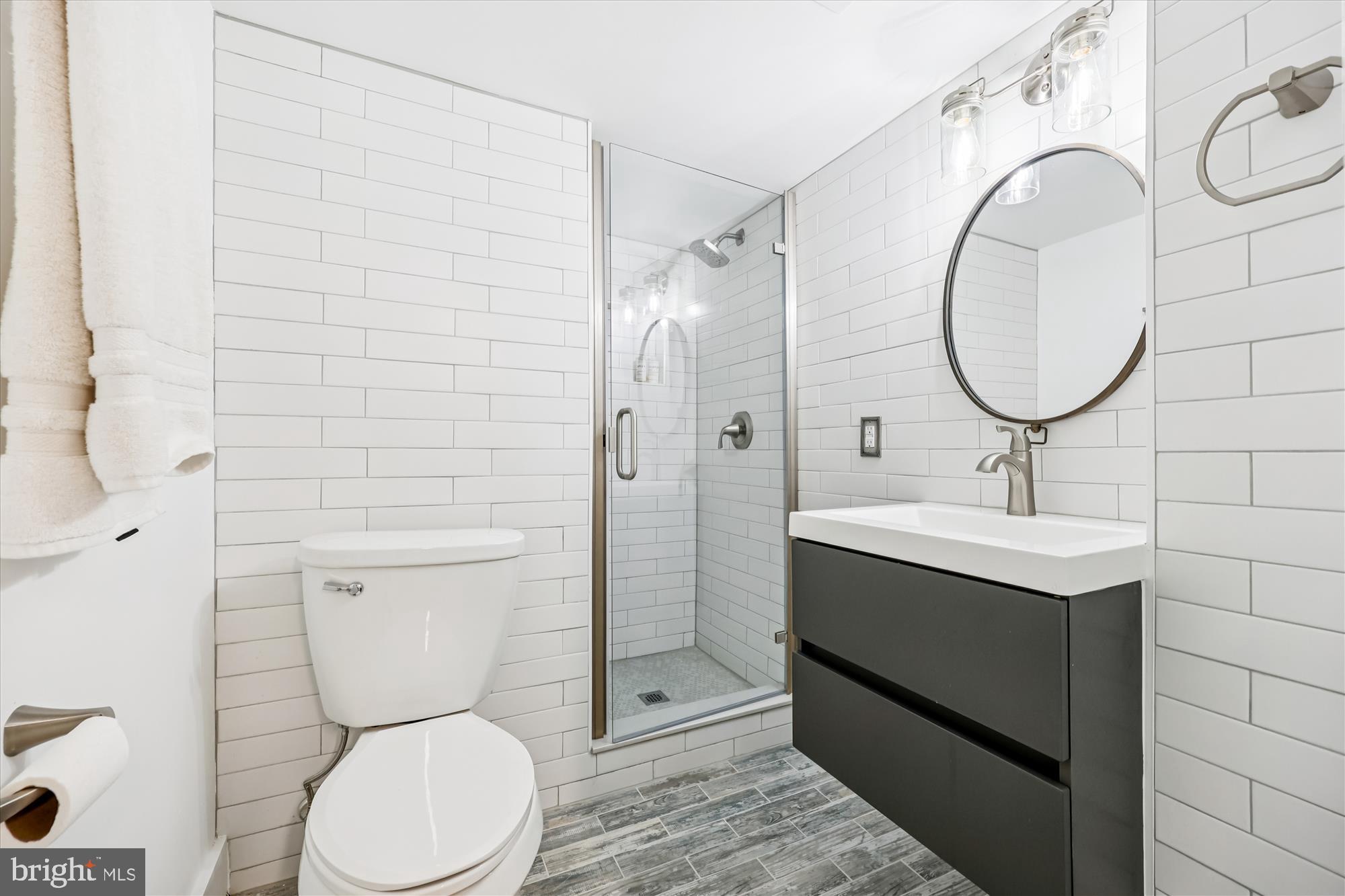 7614 Carteret Road Bethesda, MD 20817 - Photo 7 of 16 Sleek modern bathroom with elegant finishes.
