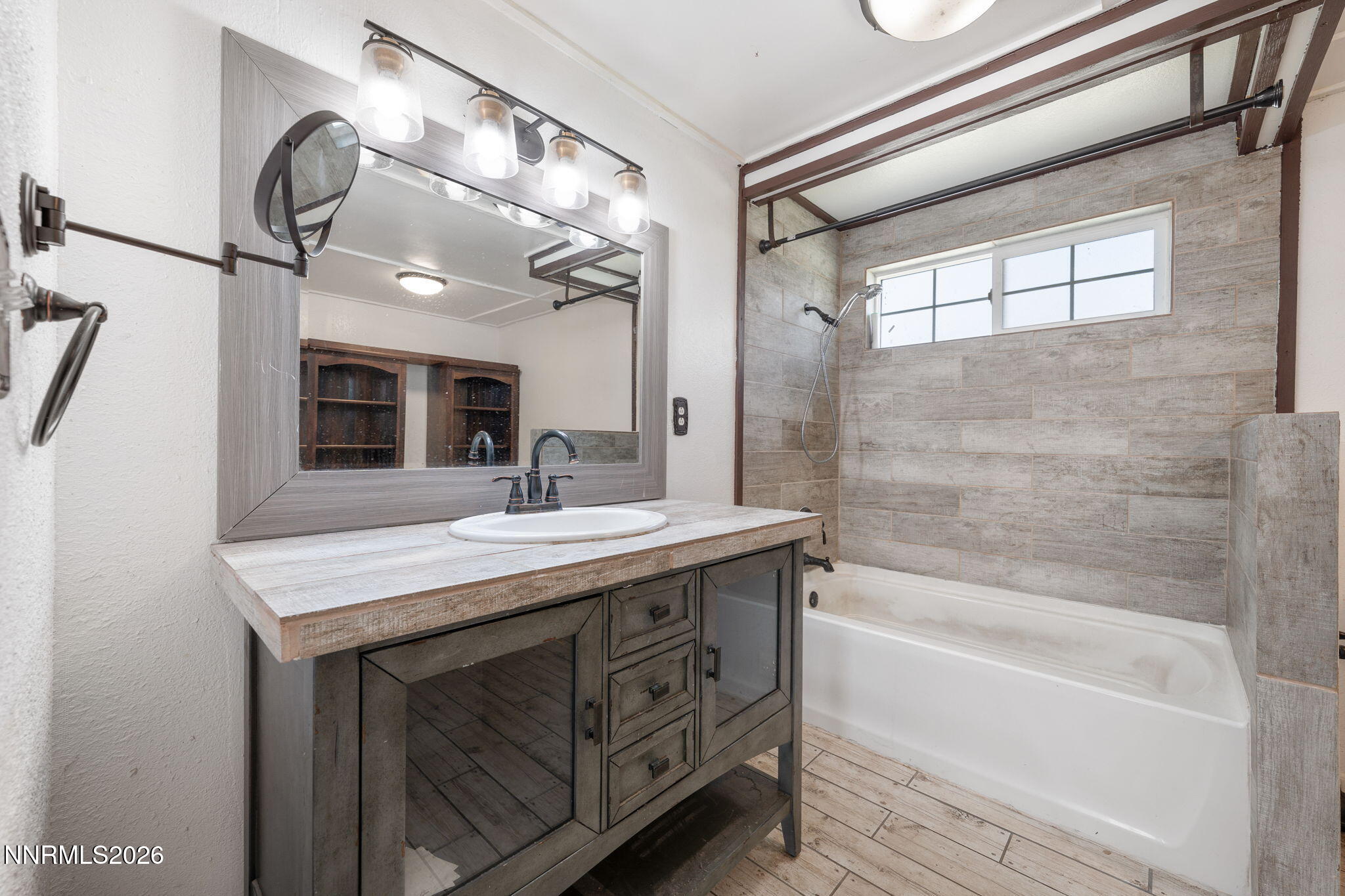 3590 Siskin Lane Reno, NV 89508 - Photo 22 of 31 a bathroom with a sink a vanity and a mirror