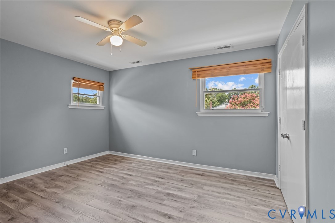 10100 Kexby Road Henrico, VA 23228 - Photo 17 of 32 Empty room featuring light wood-type flooring and