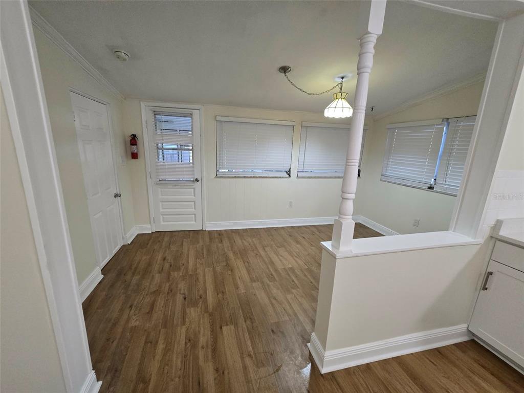 3301 West Woodlawn Avenue Tampa, FL 33607 - Photo 11 of 39 wooden floor in an empty room