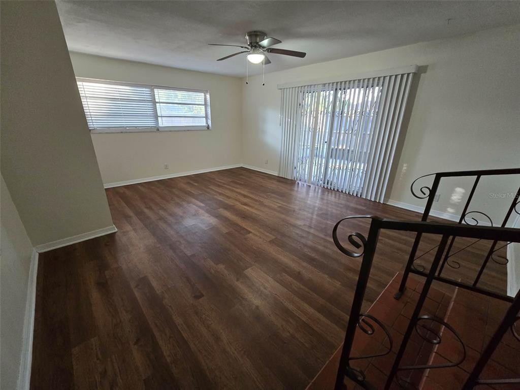 3301 West Woodlawn Avenue Tampa, FL 33607 - Photo 18 of 39 wooden floor in an empty room with a window