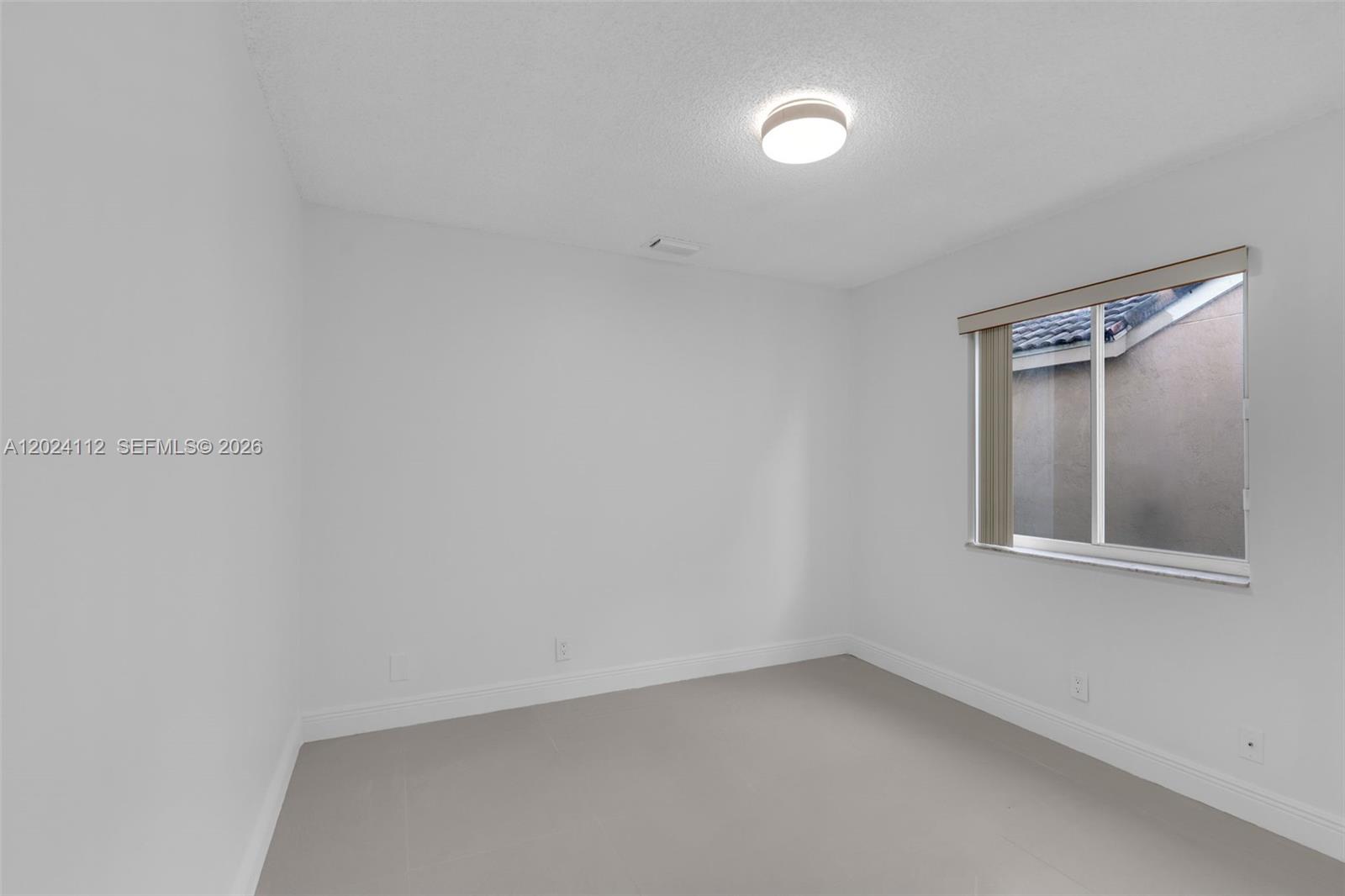 4366 Mahogany Ridge Drive Weston, FL 33331 - Photo 16 of 41 an empty room with a window