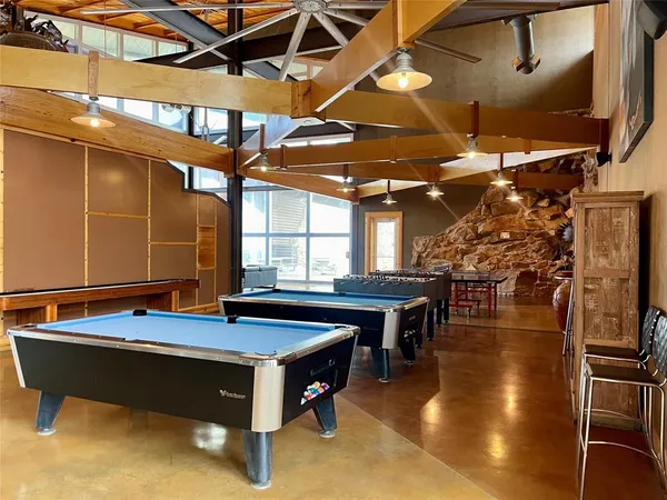 a swimming pool with outdoor seating