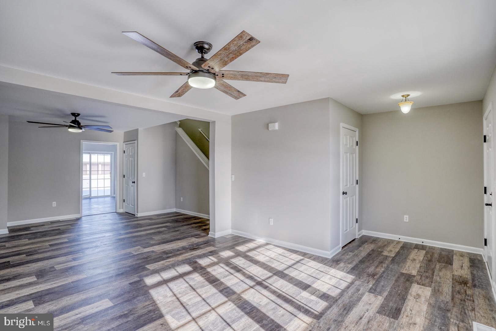 39 High Street Kenton, DE 19955 - Photo 11 of 49 a view of a big room with wooden floor and windows