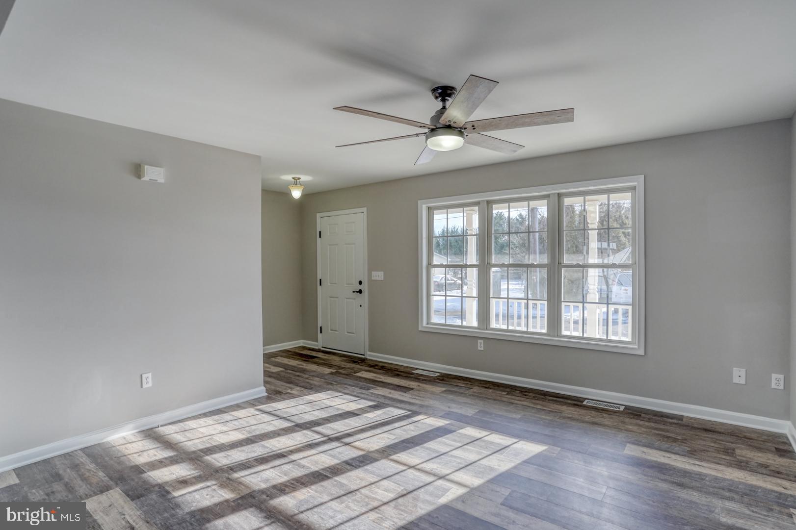 39 High Street Kenton, DE 19955 - Photo 12 of 49 a view of an empty room with a window and a kitchen