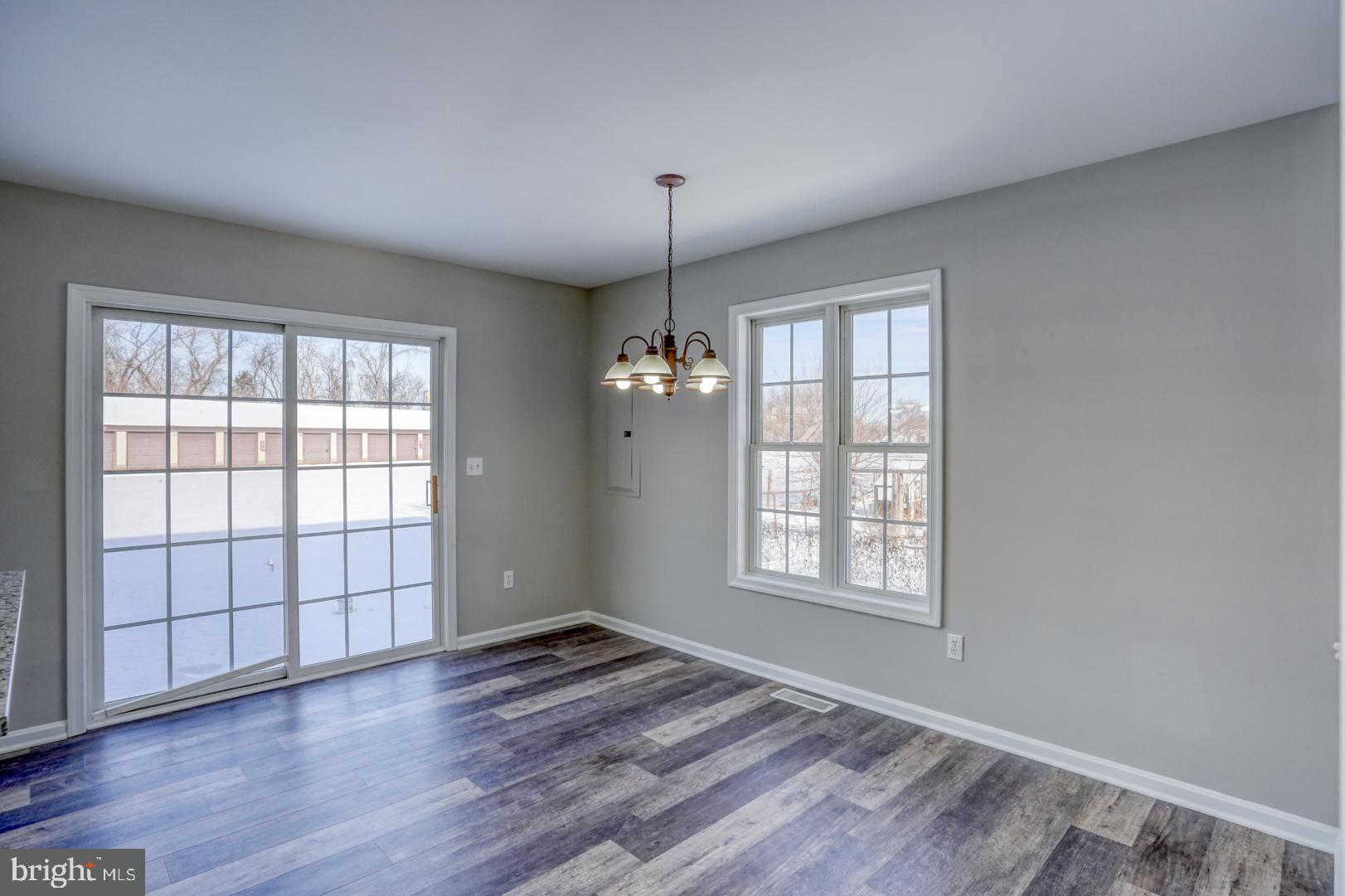 39 High Street Kenton, DE 19955 - Photo 18 of 49 an empty room with wooden floor and windows