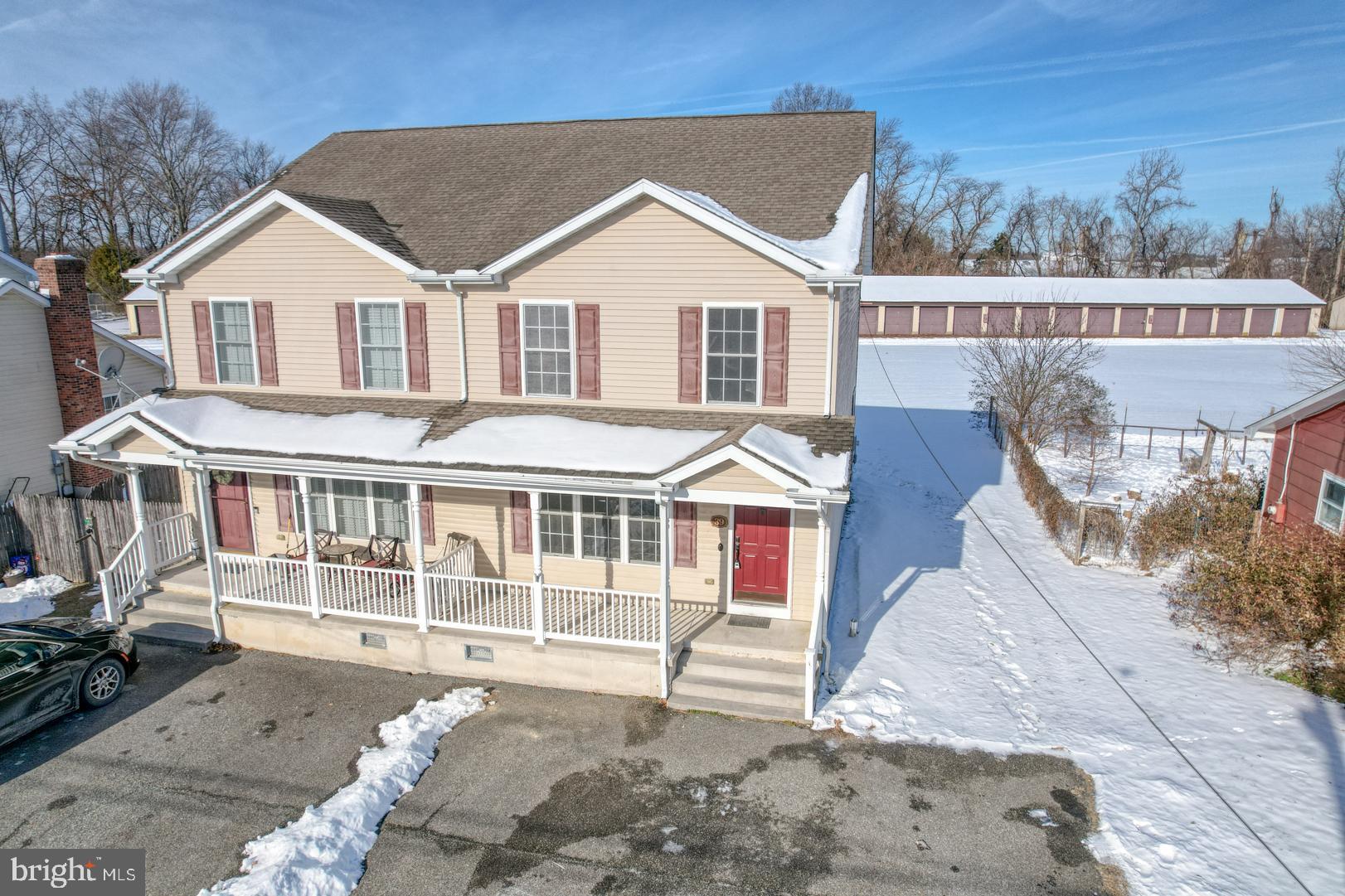 39 High Street Kenton, DE 19955 - Photo 2 of 49 a view of a white house with a large windows and wooden fence